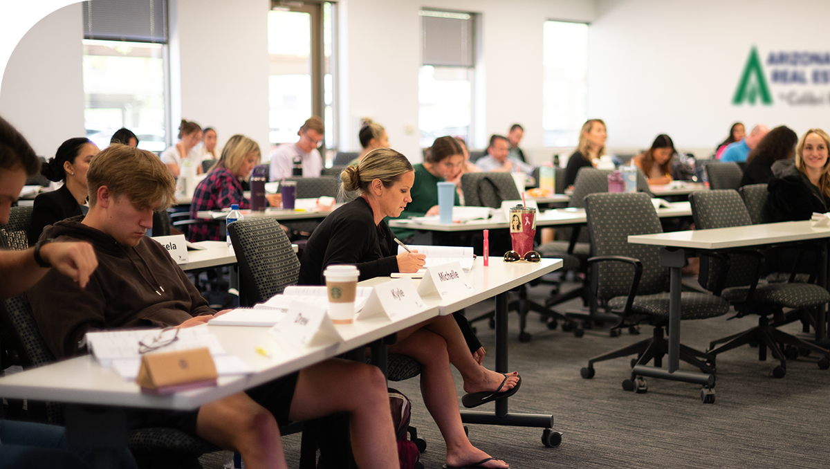 Real estate agents show a couple features of a beautiful home – how to get your real estate license in Arizona